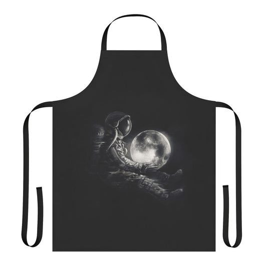 Black and white image of an apron with a surreal, space-inspired design featuring planets, stars, and an astronaut silhouette.
