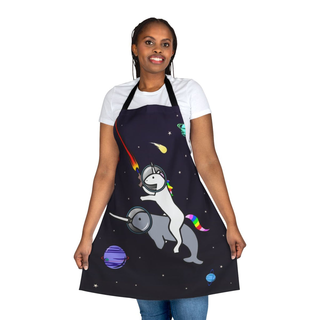 Whimsical apron featuring a unicorn riding a narwhal in outer space