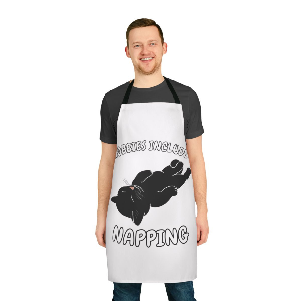 Apron featuring a black cat napping and the text "Hobbies Include Napping"