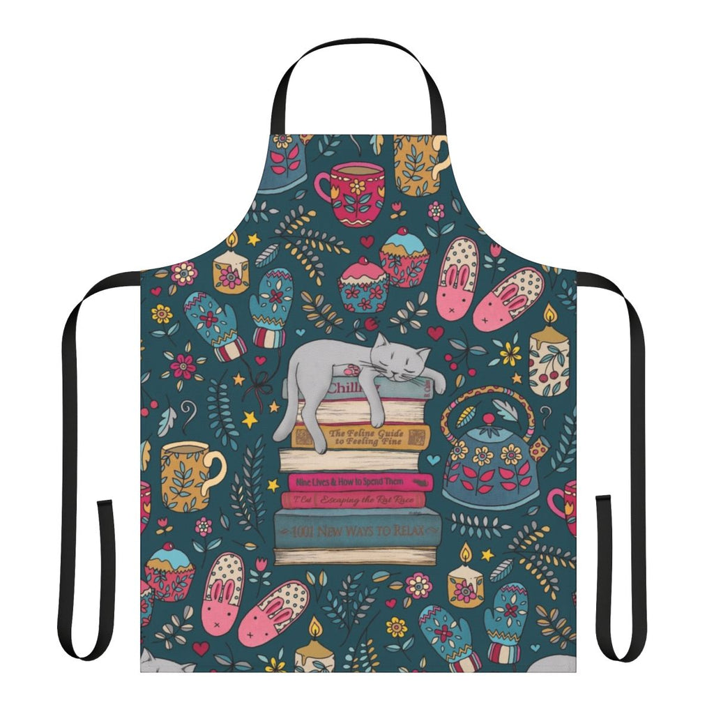 A dark green and pink apron with a cute cat sleeping on a book design, perfect for embracing the hygge lifestyle.