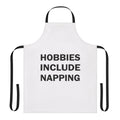 A white apron with a playful "Hobbies Include Napping" design, perfect for taking power naps or enjoying a relaxing rest.
