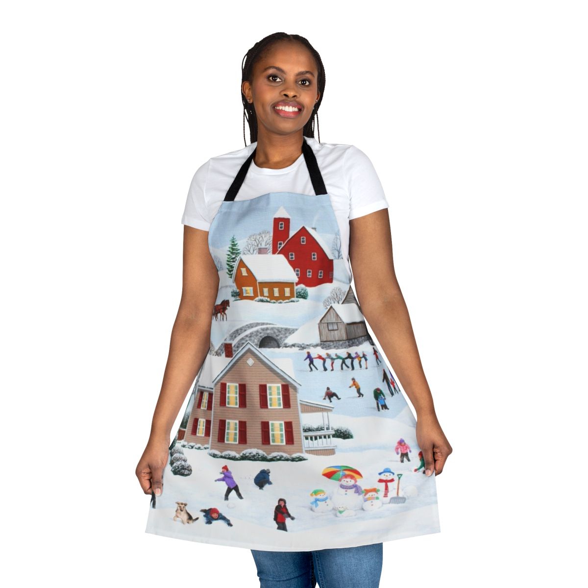 A winter themed apron featuring a snowy landscape with a snowman, tree, and ice skaters.