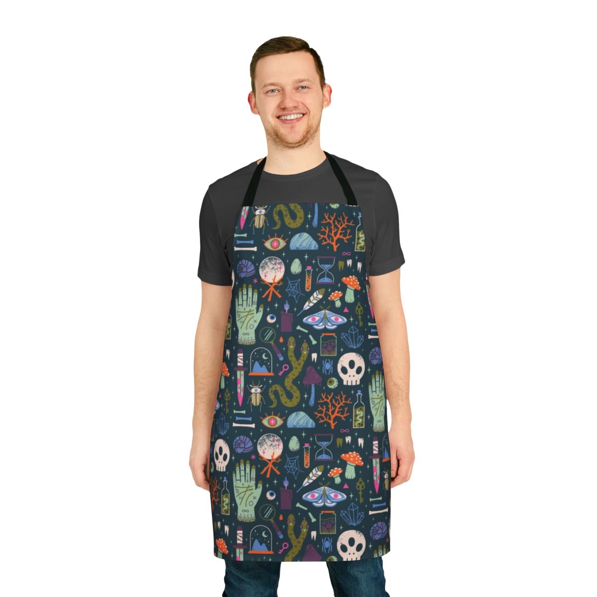 Curiosities apron featuring a collection of witchy, spooky, and occult elements