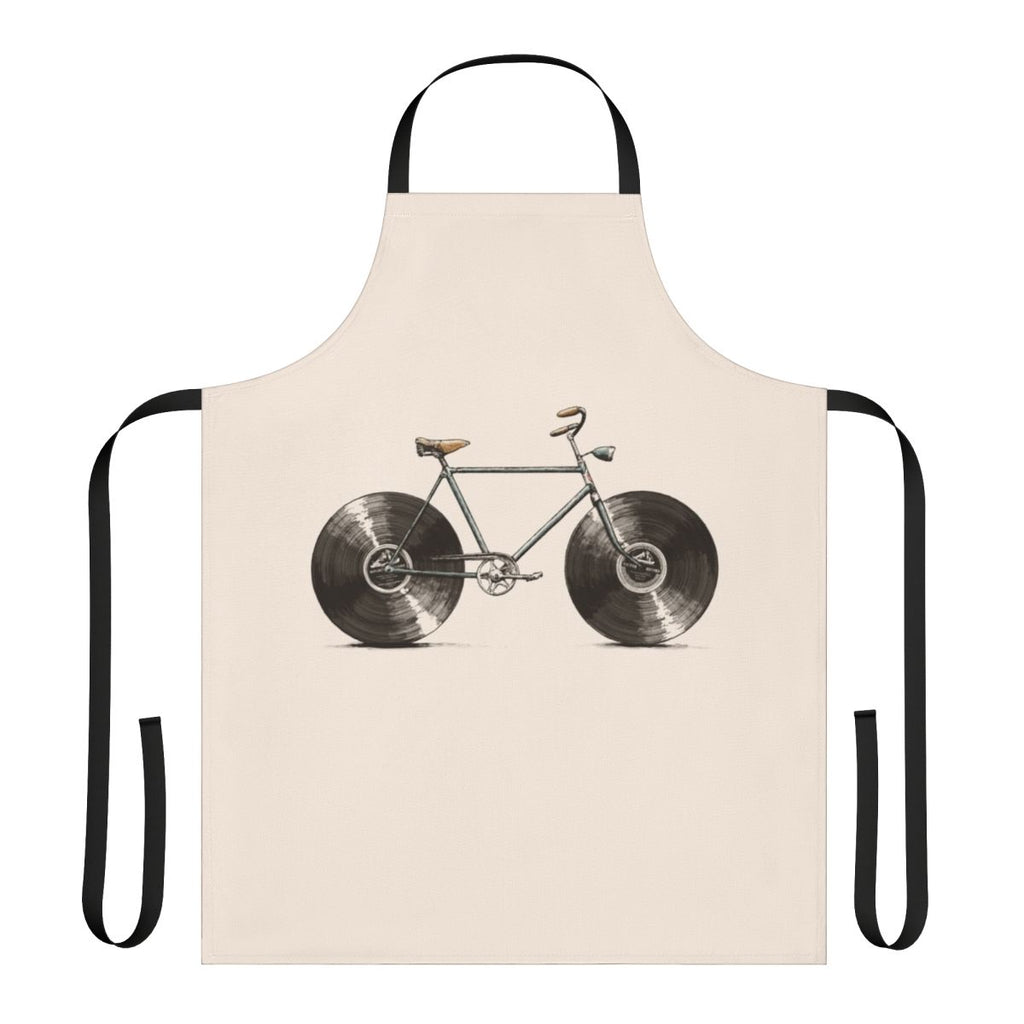 A colorful apron featuring musical notes, bikes, and vinyl records, perfect for kitchen or workshop use.