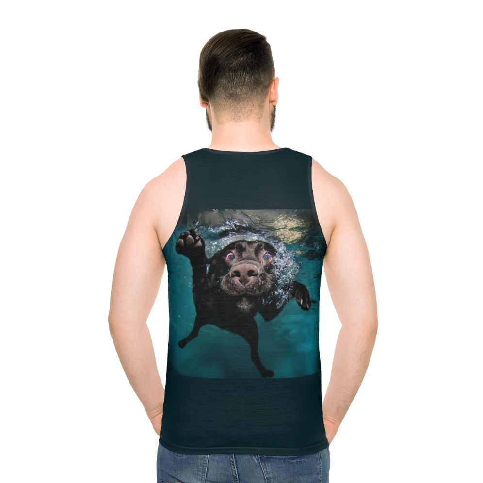 Cute dog swimming underwater in tank top