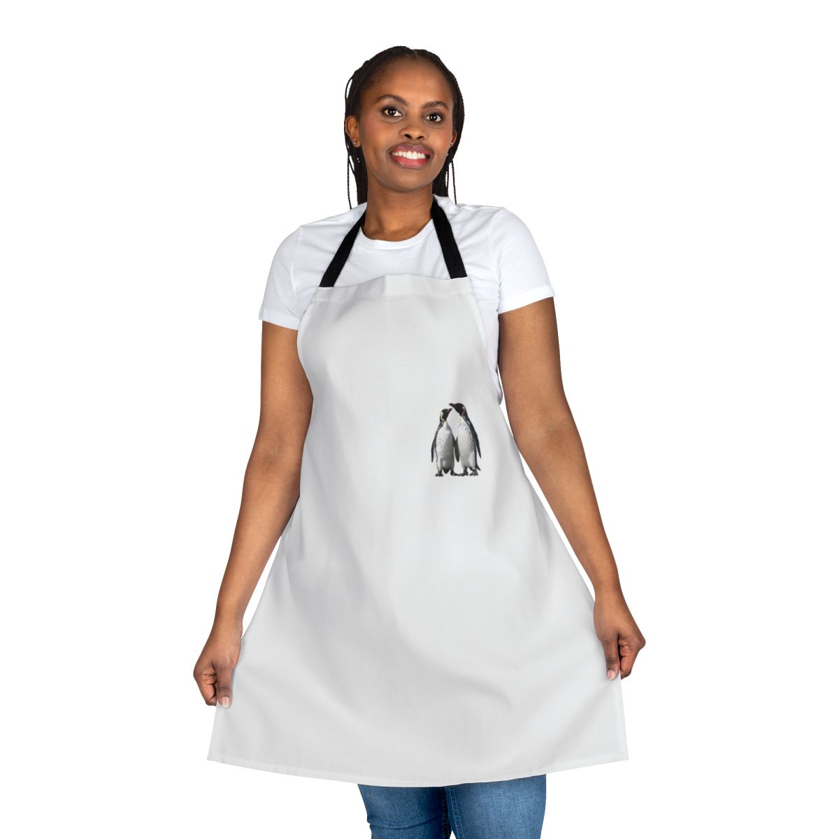 Two adorable black and white penguins on a winter-themed apron