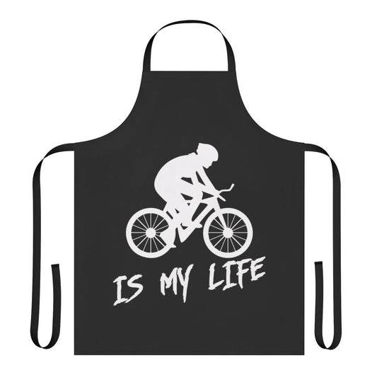 Person wearing a "Cycling Is My Life" themed apron while working in the kitchen