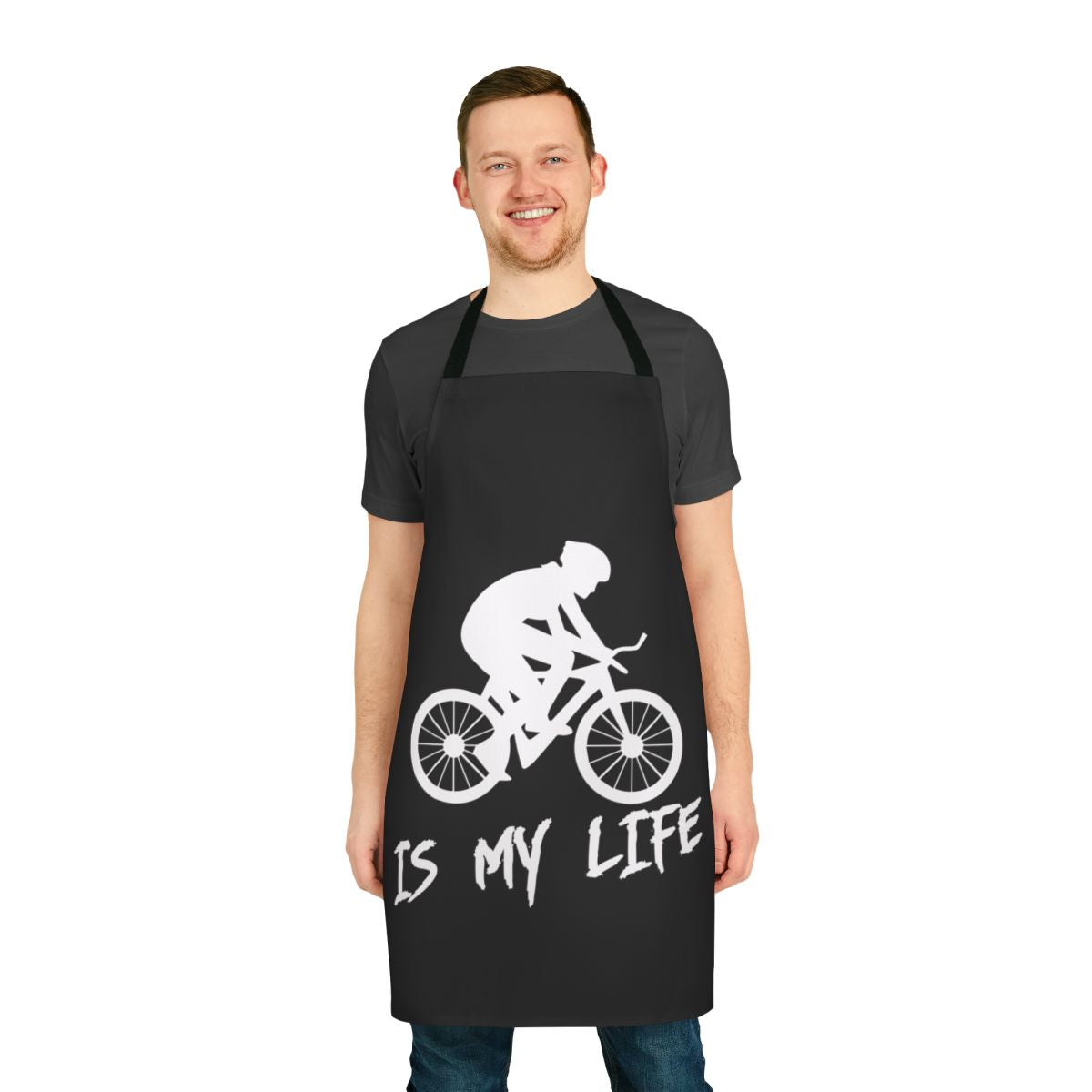 Person wearing a "Cycling Is My Life" themed apron while working in the kitchen