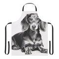 A black and white pencil sketch of a dachshund dog lying down, printed on a white kitchen apron.