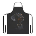 A digital watercolor illustration of a brown and black dachshund on an apron.