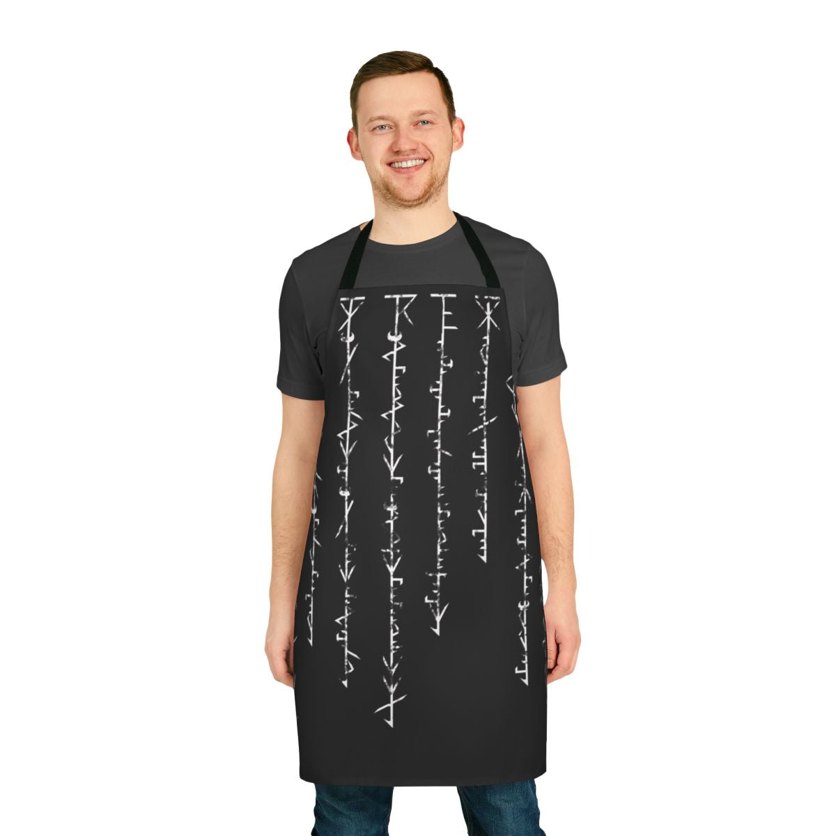 A black apron featuring a Phyrexian-inspired inscription, perfect for Magic the Gathering enthusiasts.