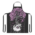 A black apron with a skull and cherry blossom design, a gothic and macabre style perfect for the kitchen.