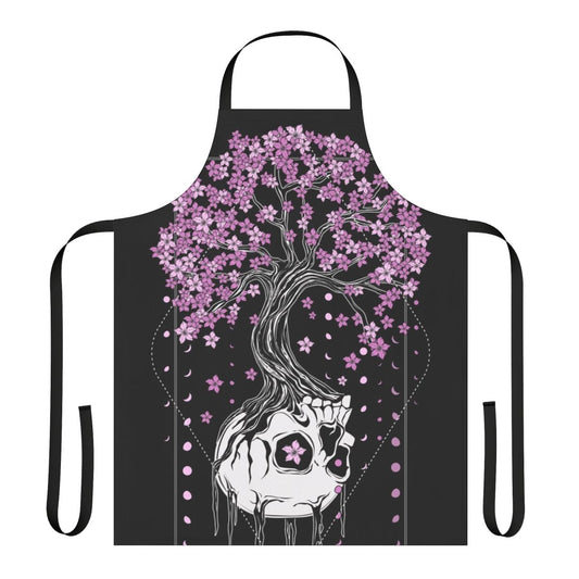 A black apron with a skull and cherry blossom design, a gothic and macabre style perfect for the kitchen.