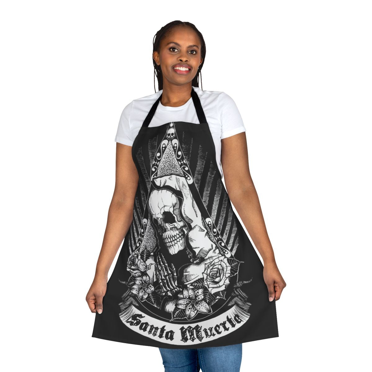 A black and white apron featuring a skull, skeleton, flowers, and the image of Santa Muerte, the Mexican folk saint.
