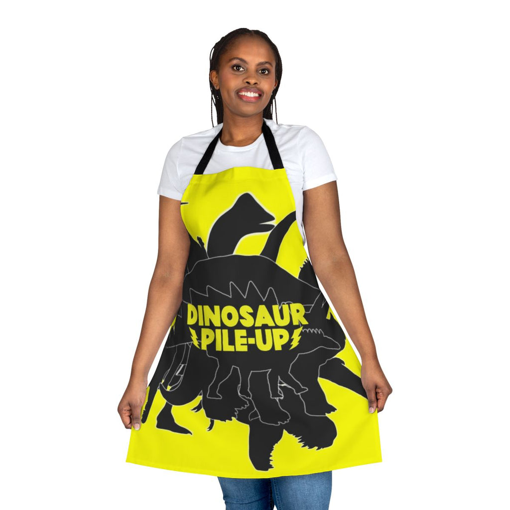 Dinosaur Pile Up themed apron with various dinosaur silhouettes