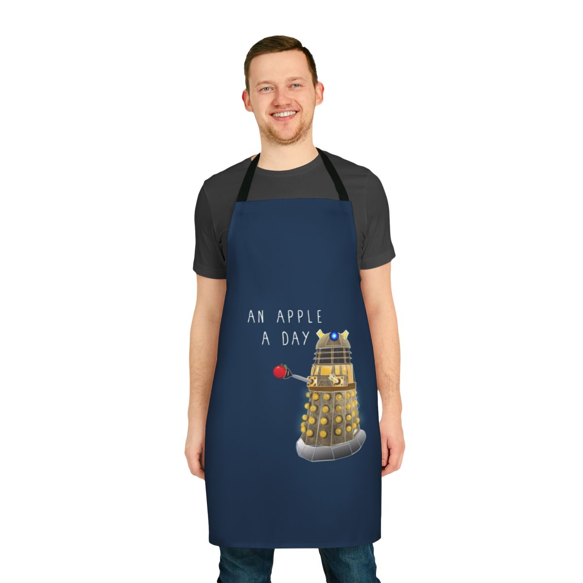A quirky apron featuring an apple design and the phrase "An Apple a Day Keeps the Doctor Away"