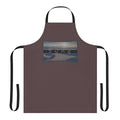 Dune-inspired apron with a brown background and desert-themed design
