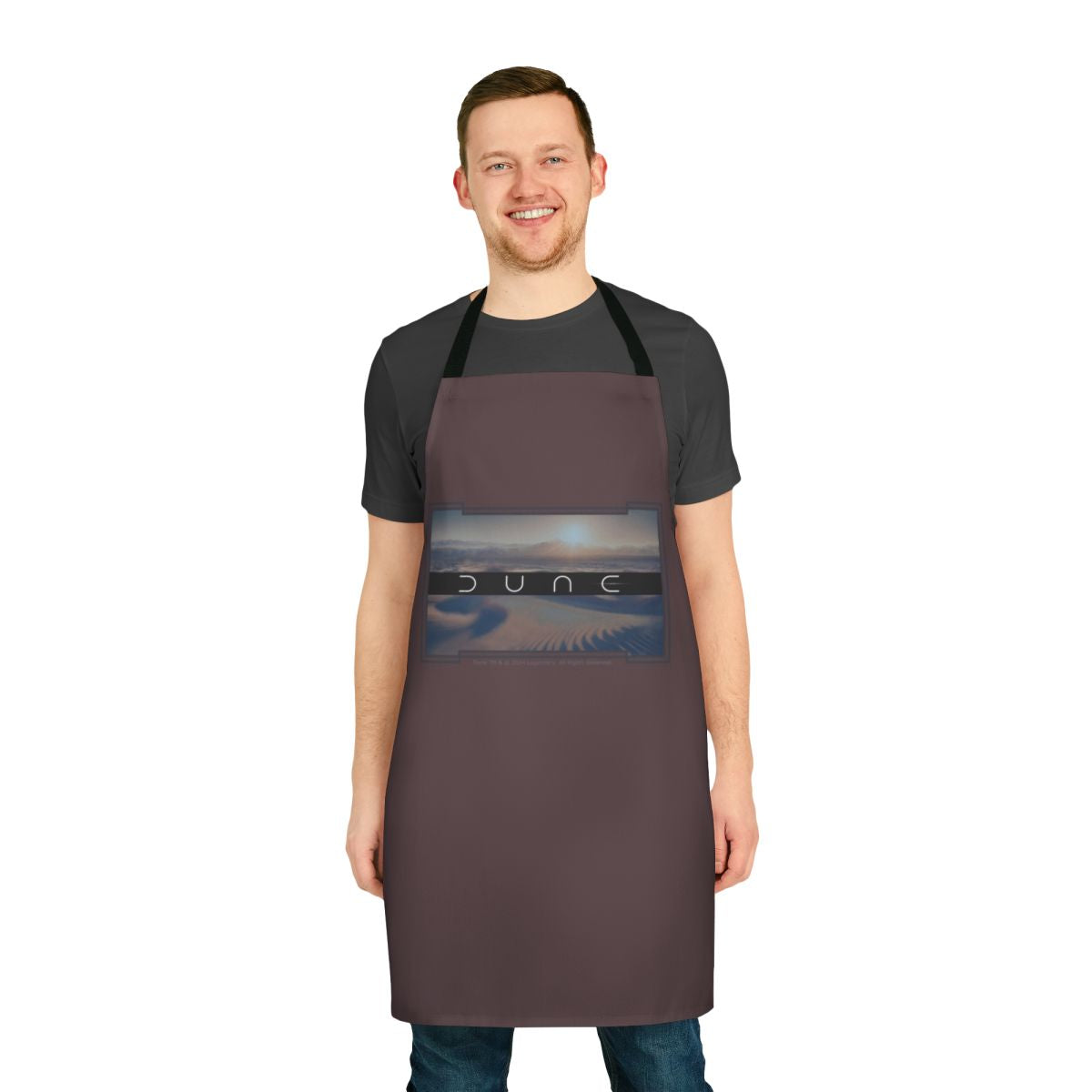 Dune-inspired apron with a brown background and desert-themed design