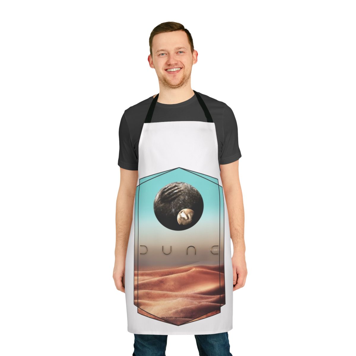 Dune-inspired apron featuring a stylized design of the planet Arrakis and the House Atreides crest
