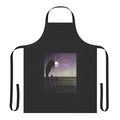 Person wearing a durable, highway-inspired apron while cooking in the kitchen