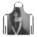 Black and white apron featuring the name "Adore Delano" and inspired by the drag performer