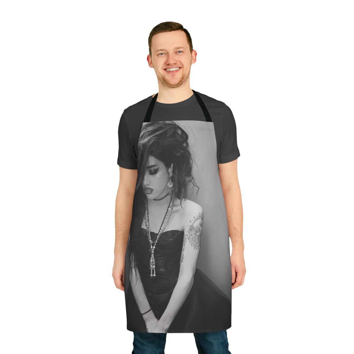 Black and white apron featuring the name "Adore Delano" and inspired by the drag performer