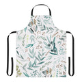 Vibrant, watercolor-style pattern of eucalyptus leaves on a boho-inspired apron
