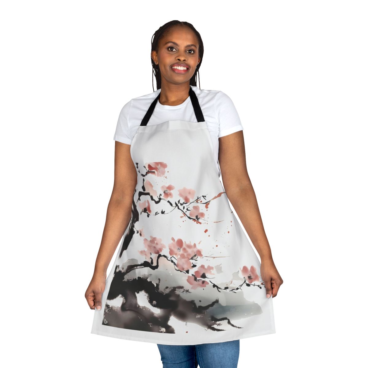 Stylish apron featuring a beautiful cherry blossom design, perfect for the kitchen or craft room.