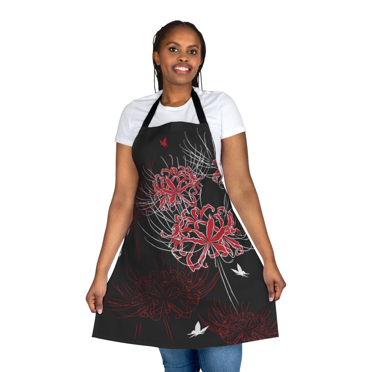 Close-up of a red and black butterfly perched on a spider lily flower, set against a Japanese-inspired floral pattern on an apron.