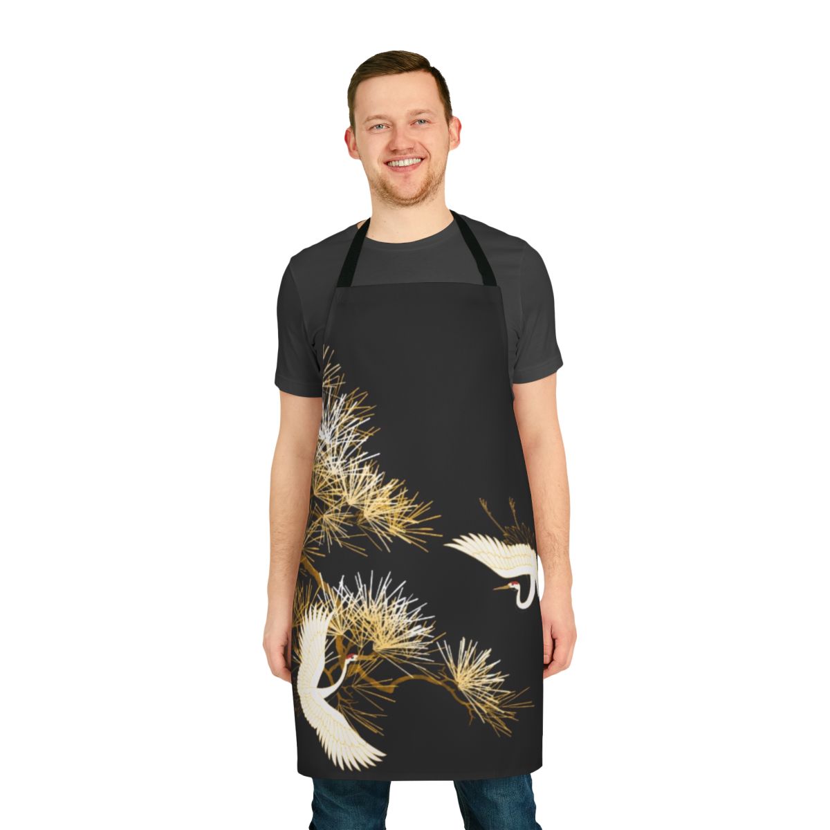 Golden Japanese cranes embroidered on a beautiful black apron, with a floral and bird pattern.
