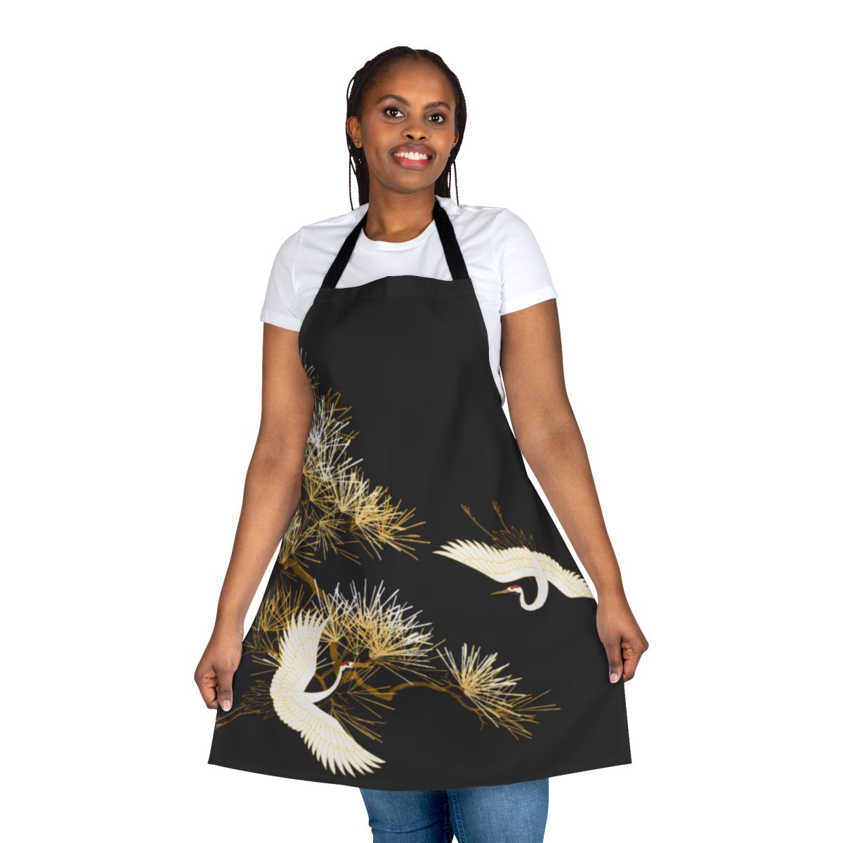 Golden Japanese cranes embroidered on a beautiful black apron, with a floral and bird pattern.