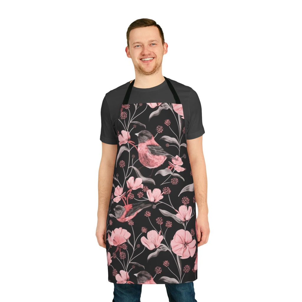 Stylish apron featuring a pink, black, and white botanical design with birds and flowers.