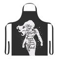 Woman wearing a black apron with the text "You Are Stronger" printed on it.