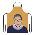 A yellow apron featuring the words "Notorious RBG" and an illustration of Ruth Bader Ginsburg