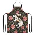An enchanted apron featuring a dark, mystical floral pattern with bunnies, stars, and nature elements.