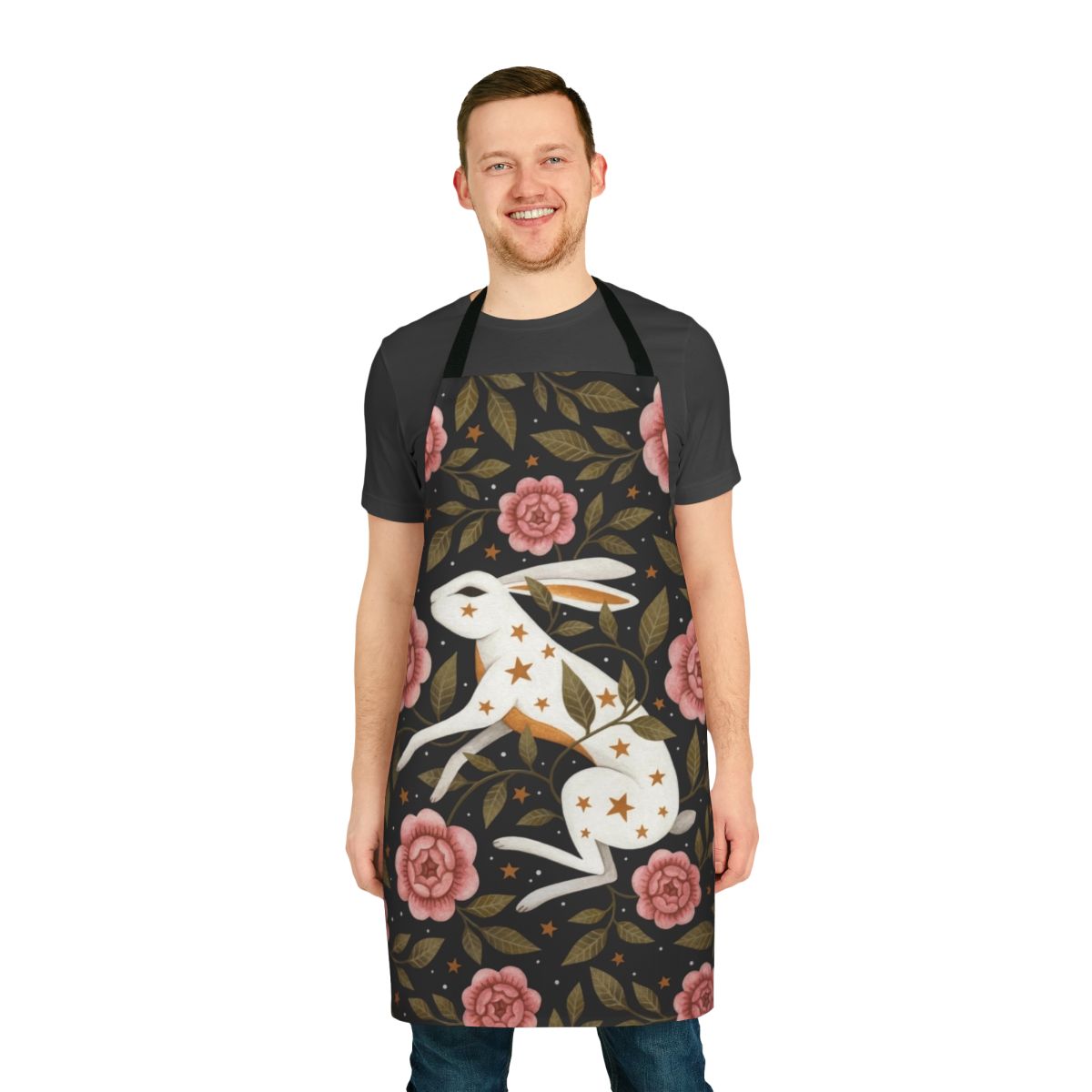 An enchanted apron featuring a dark, mystical floral pattern with bunnies, stars, and nature elements.