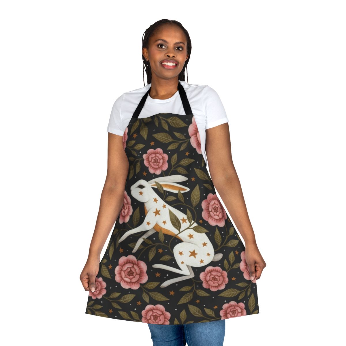 An enchanted apron featuring a dark, mystical floral pattern with bunnies, stars, and nature elements.