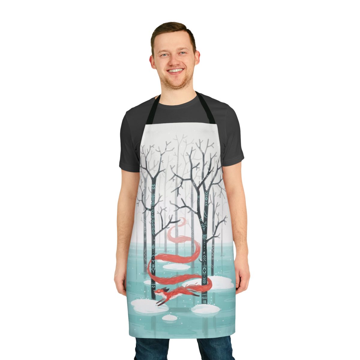 An apron featuring a whimsical forest spirit fox design in shades of blue, red, and white.