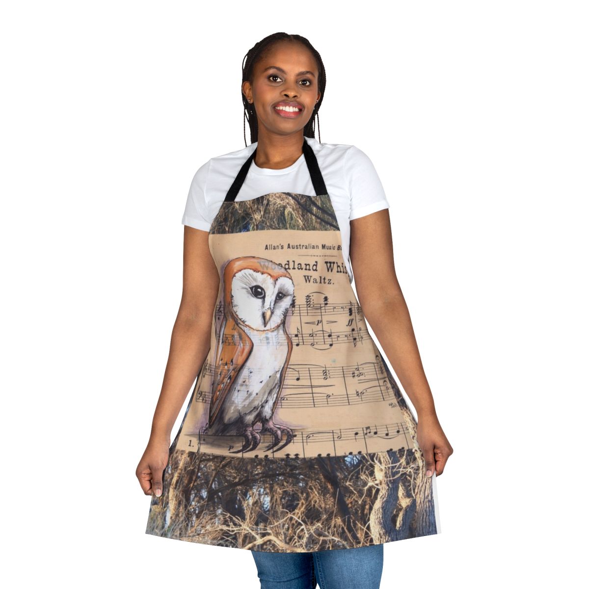 Whimsical apron featuring a barn owl perched among musical notes and nature elements