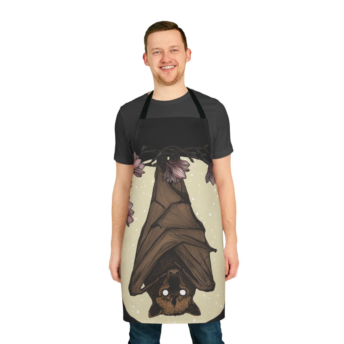 Striking black and white sketch-style illustration of a bat or flying fox on a round apron with floral and nature motifs