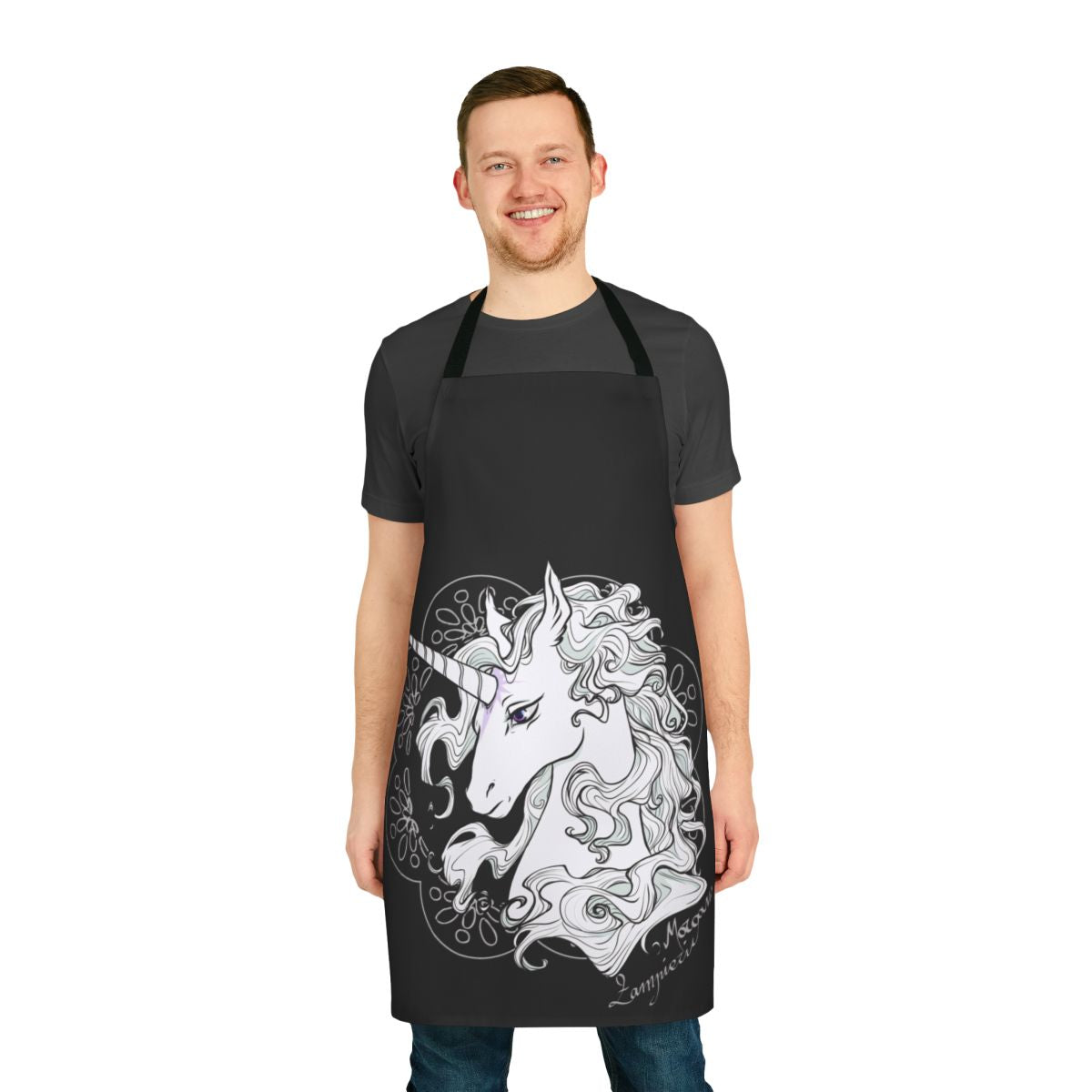 A black apron featuring a magical unicorn design, inspired by the classic fantasy novel The Last Unicorn.