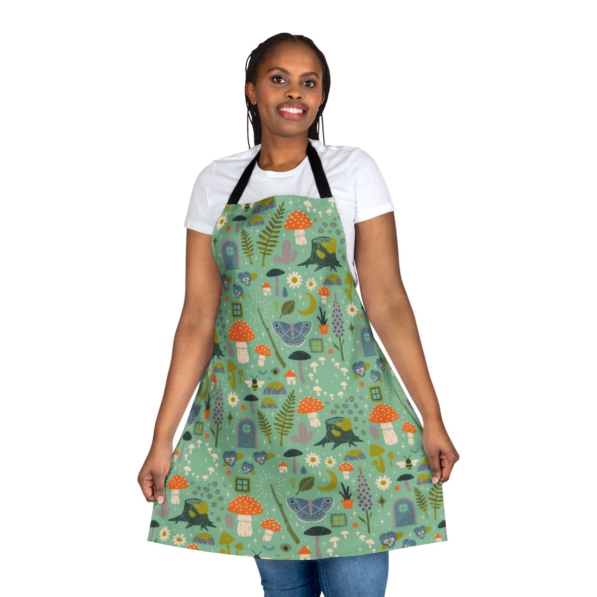 A whimsical floral apron featuring mushrooms, butterflies, and flowers, perfect for gardening or kitchen tasks.