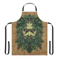 Image of a decorative apron featuring a stylized greenman illustration with intricate leaf and scroll designs.