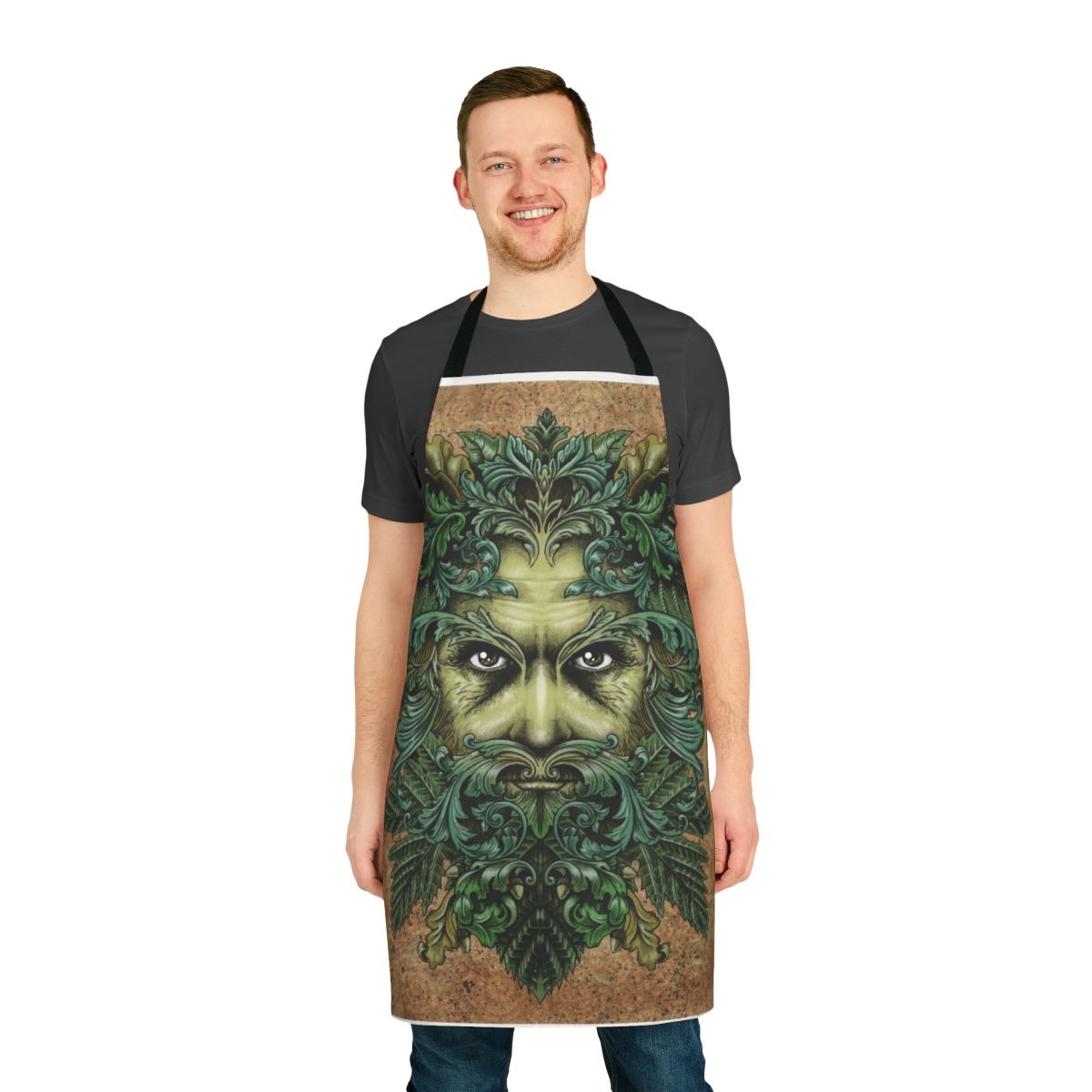 Image of a decorative apron featuring a stylized greenman illustration with intricate leaf and scroll designs.