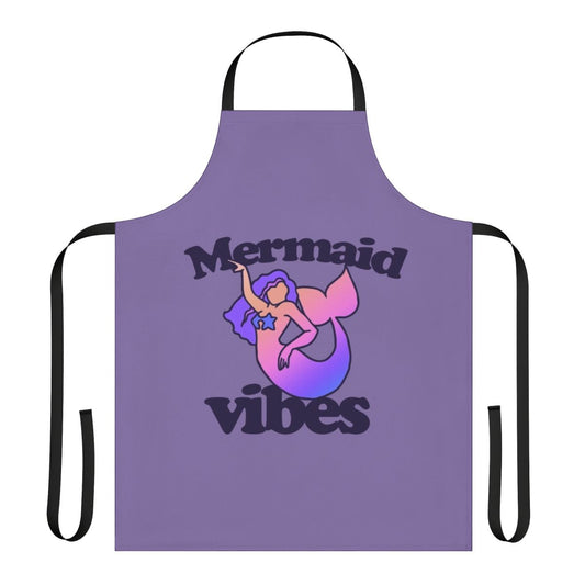 A vibrant mermaid-themed apron with shimmering scales and a whimsical design, perfect for ocean-inspired cooking and hosting.