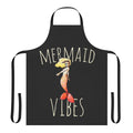 A whimsical mermaid-themed apron in vibrant blues and greens, perfect for adding a touch of ocean magic to your kitchen.