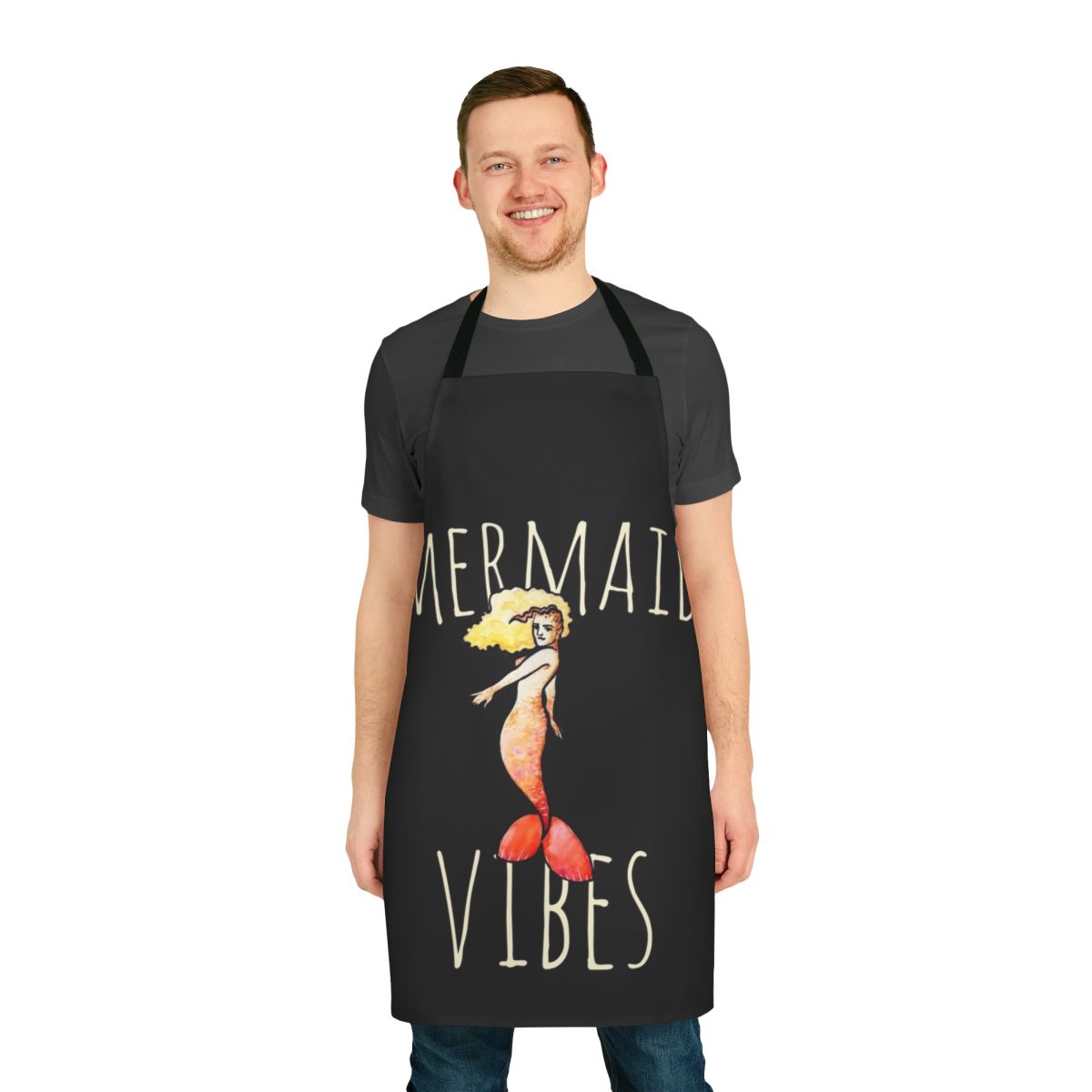 A whimsical mermaid-themed apron in vibrant blues and greens, perfect for adding a touch of ocean magic to your kitchen.