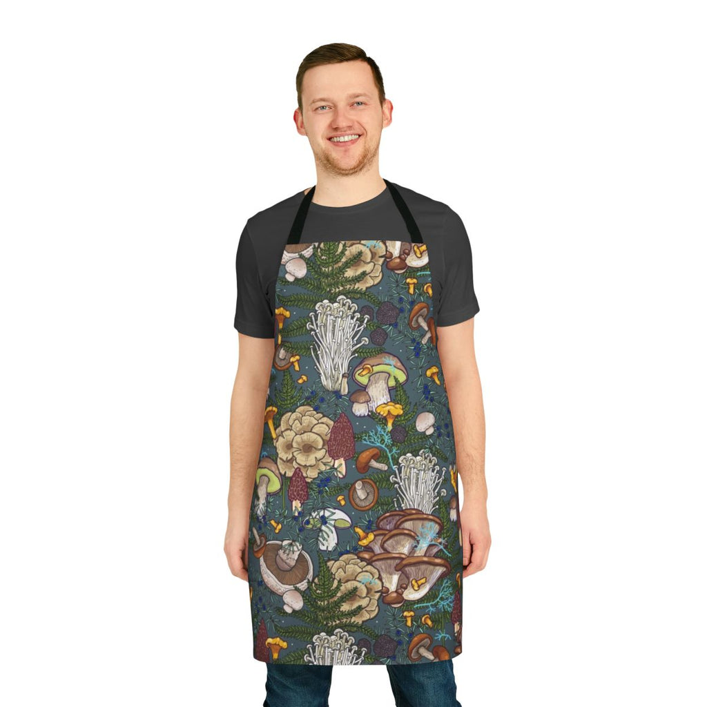 A nature-inspired apron featuring a vibrant pattern of various wild mushrooms and botanical elements.