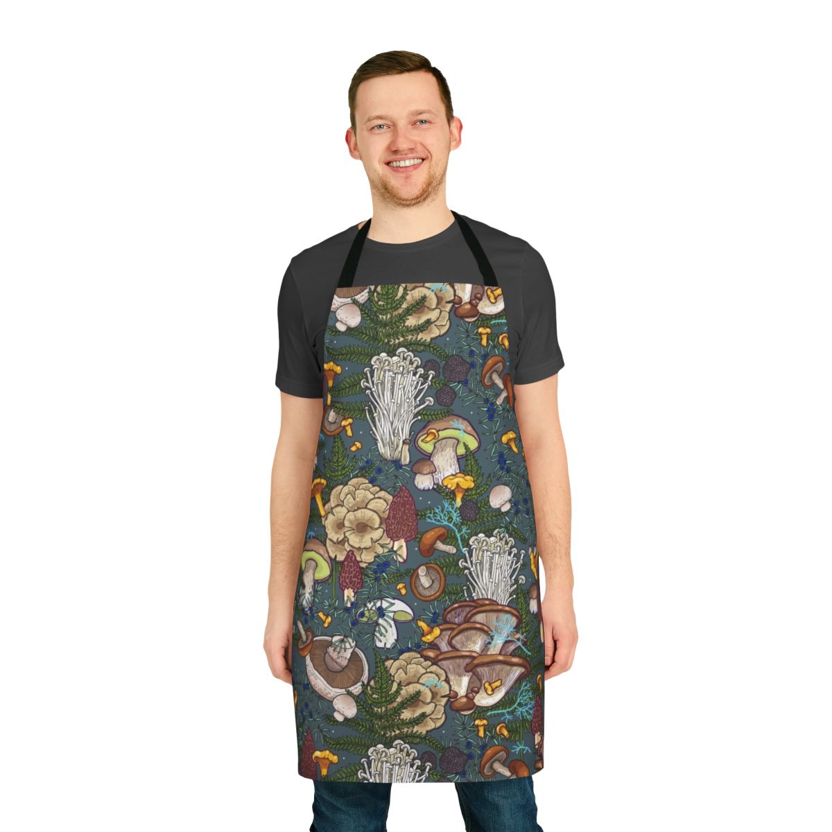A nature-inspired apron featuring a vibrant pattern of various wild mushrooms and botanical elements.