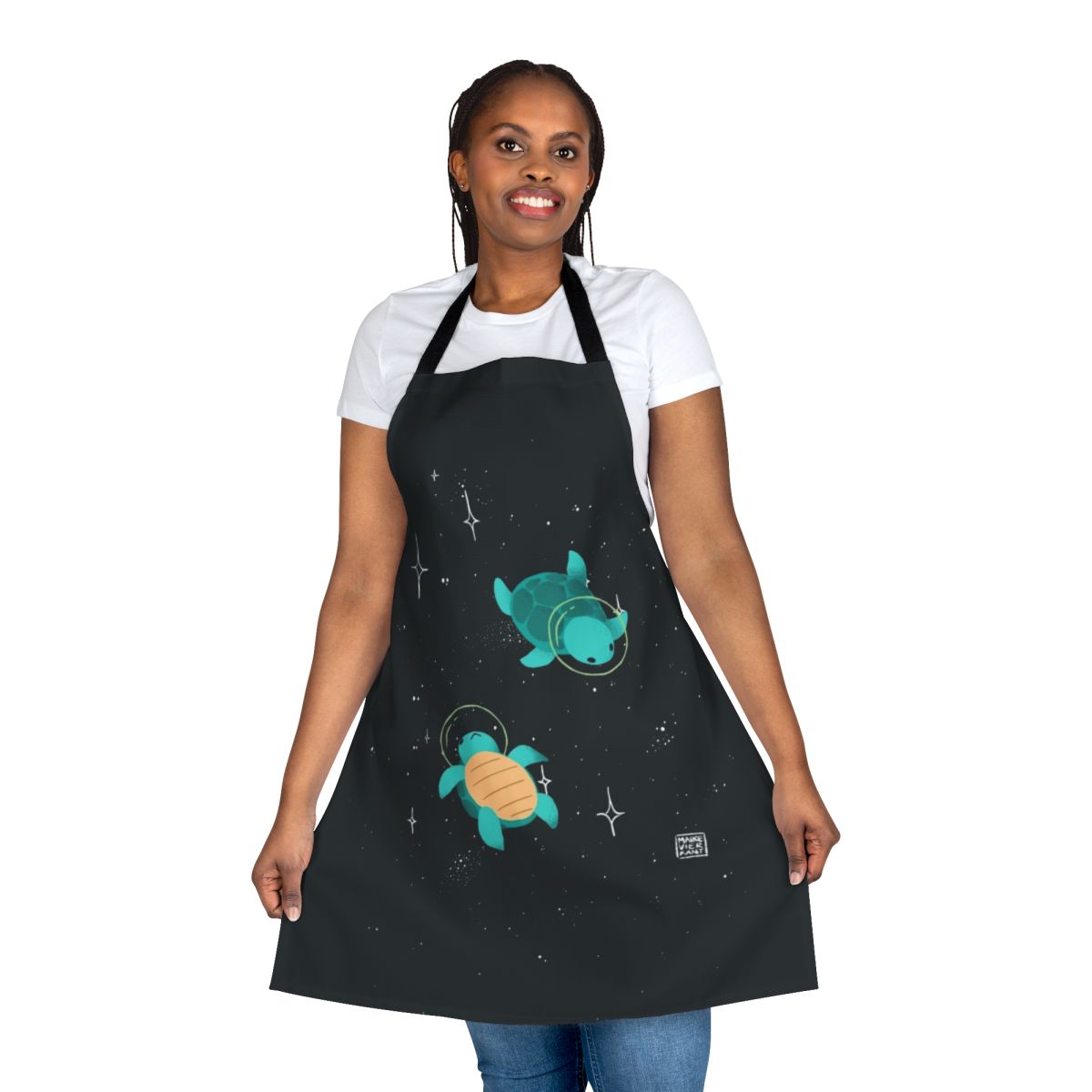 Apron featuring a design of a cute, green space turtle exploring the galaxy with stars and planets in the background.